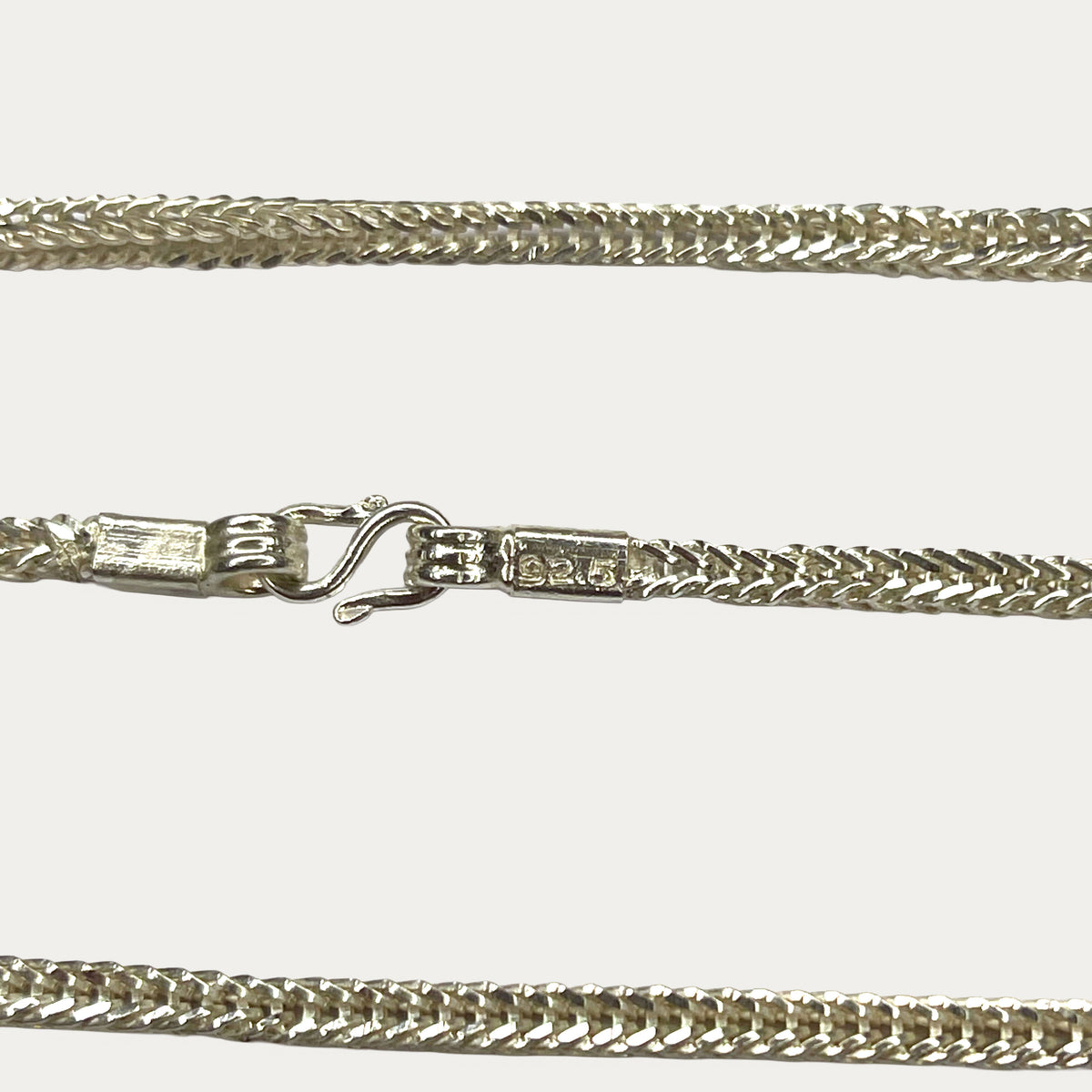 close up of hallmark and clasp of DEXZION Snake Skin Ropenecklace