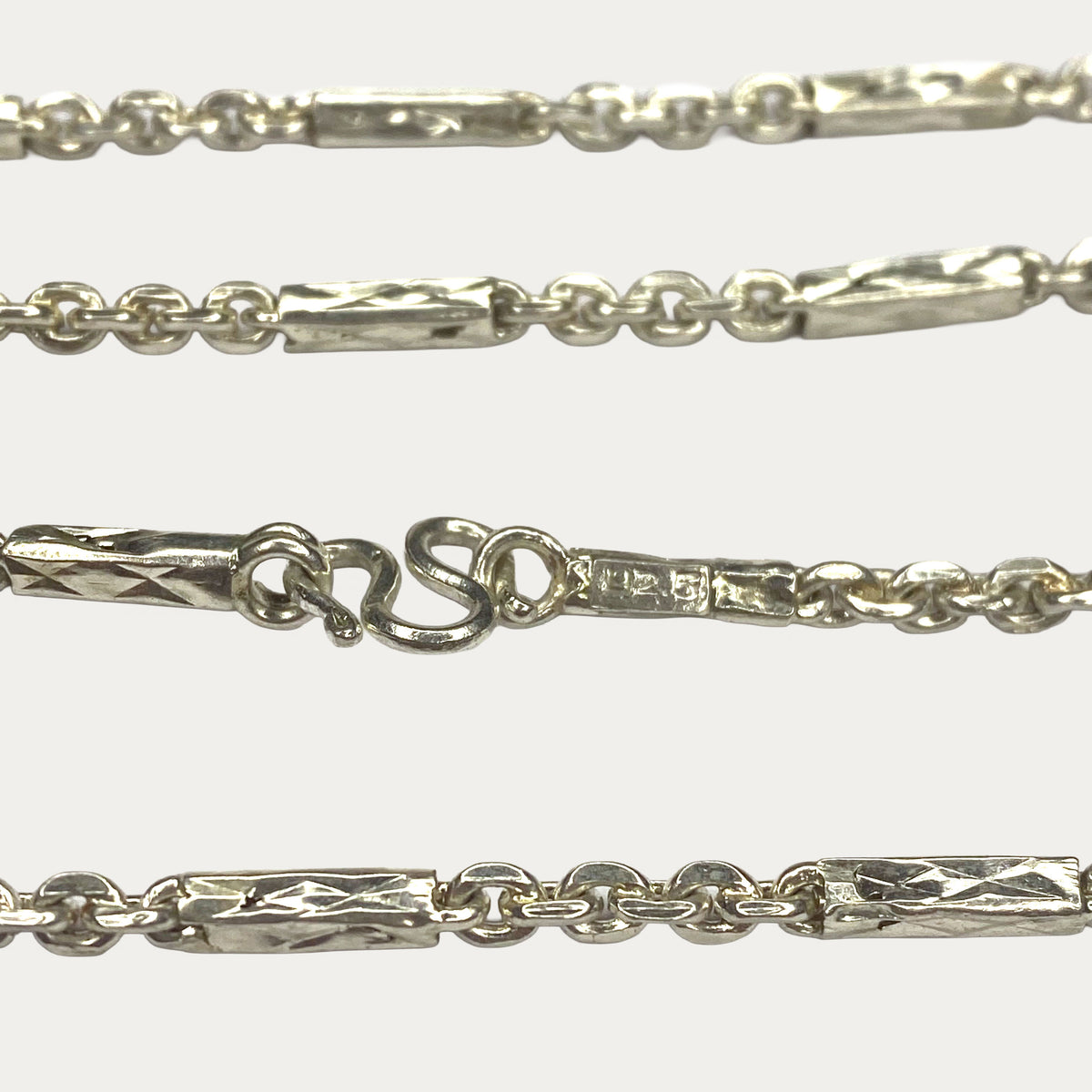  Macro close-up of 925 silver chain clasp of Khmer sugarcane link