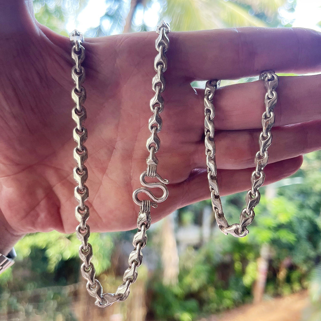 Solid 999 silver chain for men with Teardrop design held in hand for scale