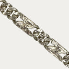 Close-up of starburst cuban link bracelet in 999 solid silver