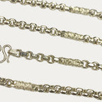 Macro close-up of silver dragon chain clasp