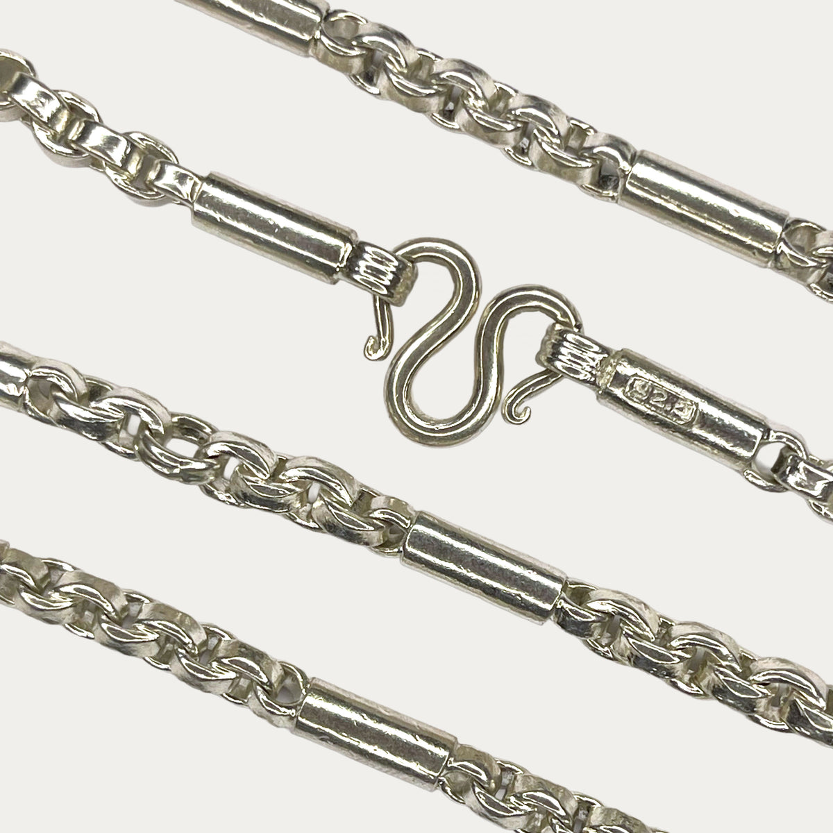 Close up of Round figaro belcher link necklace m clasp