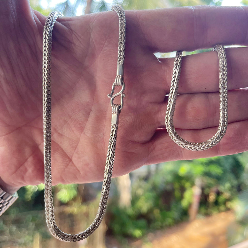 Solid sterling silver Snakeskin Square Rope chain held in hand