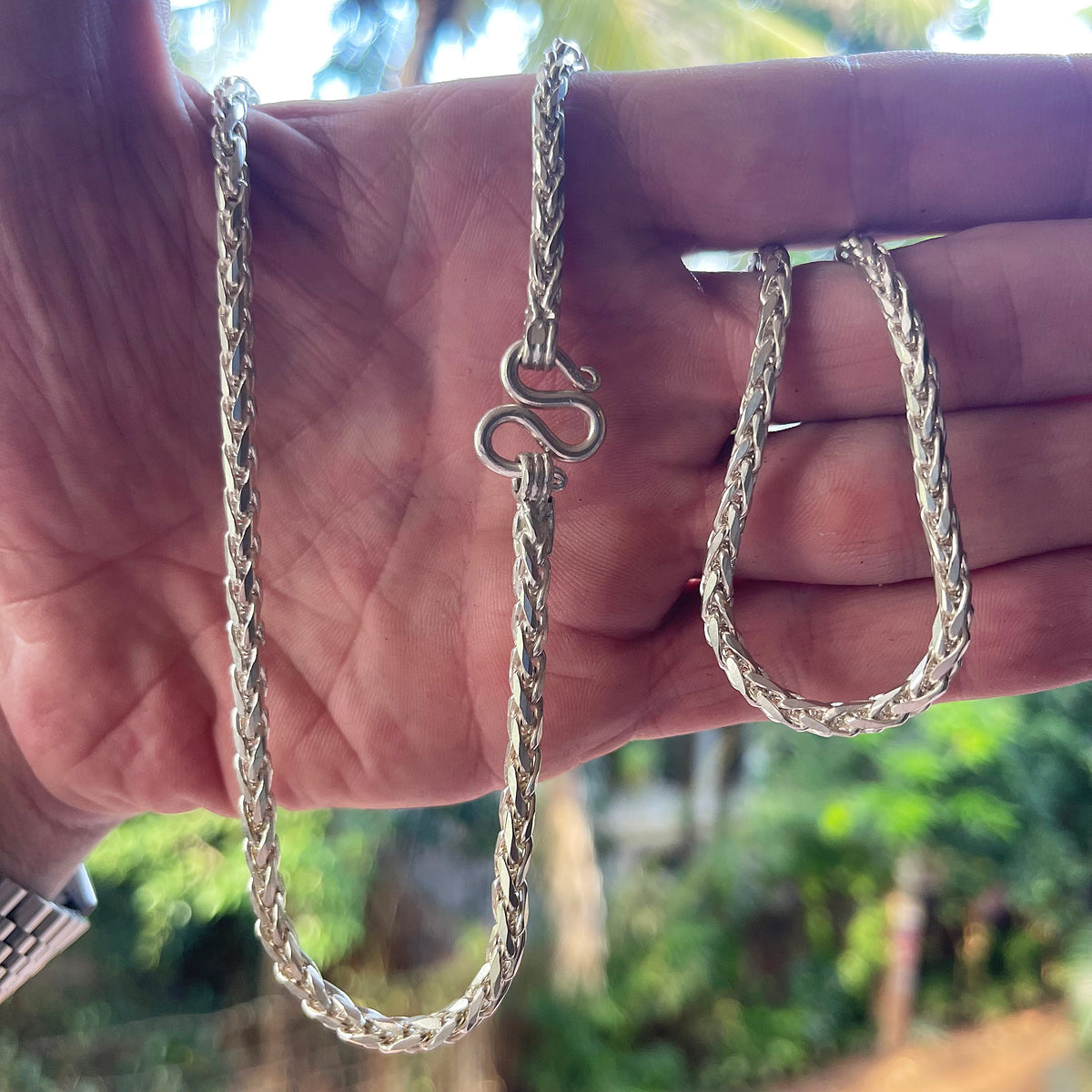  Solid silver 28 inch Dragon Scale chain held in hand