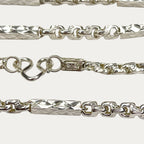 Macro close-up of silver Sugarcane Fluted Bar chain and clasp showing hallmark