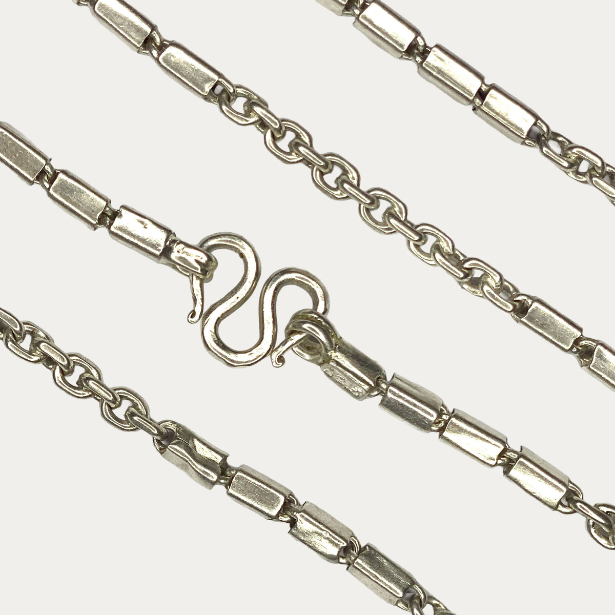 Close-up of solid silver Triple Bar Khmer chain clasp and links 