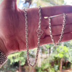 Solid silver teardrop chain for men held in hand for scale