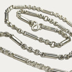 close up of round figaro belcher solid silver chain. gift for men
