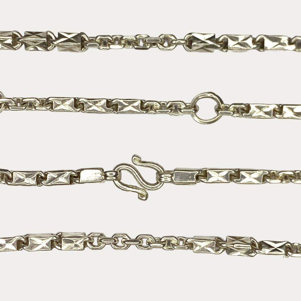 Close-up of Triple Bar Khmer Sugarcane link chain in solid silver