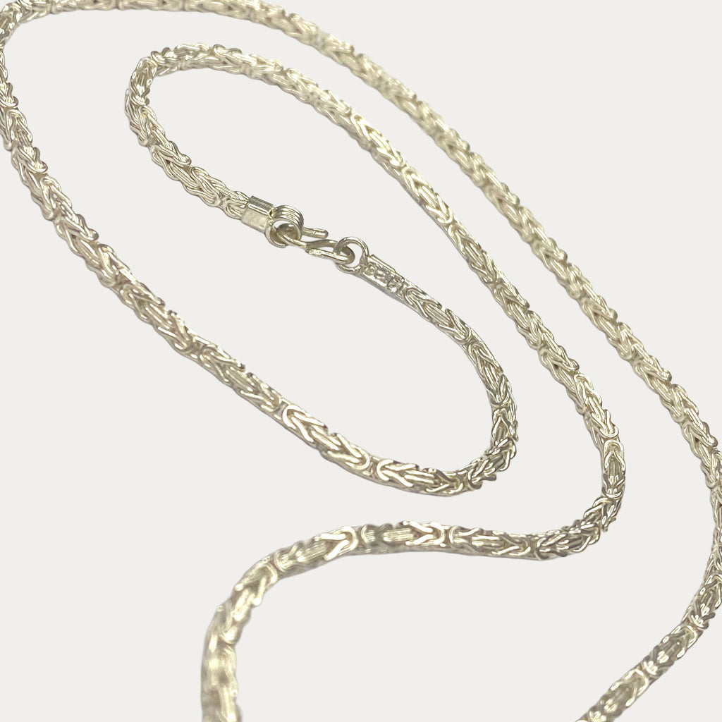 Full-length view of solid silver byzantine chain necklace