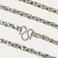 Close-up of solid silver teardrop chain clasp and links 