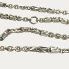 Macro close-up of silver chain hallmark with Triple Bar Khmer Sugarcane link design